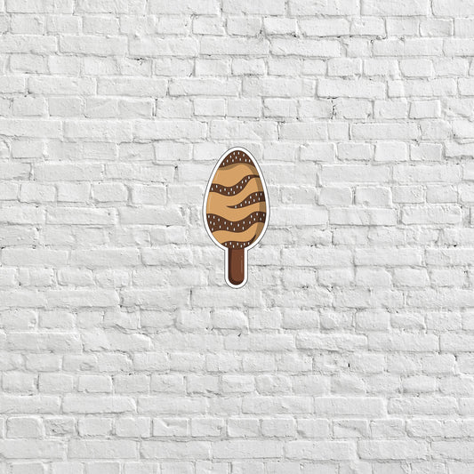 a white brick wall with an ice cream sticker on it