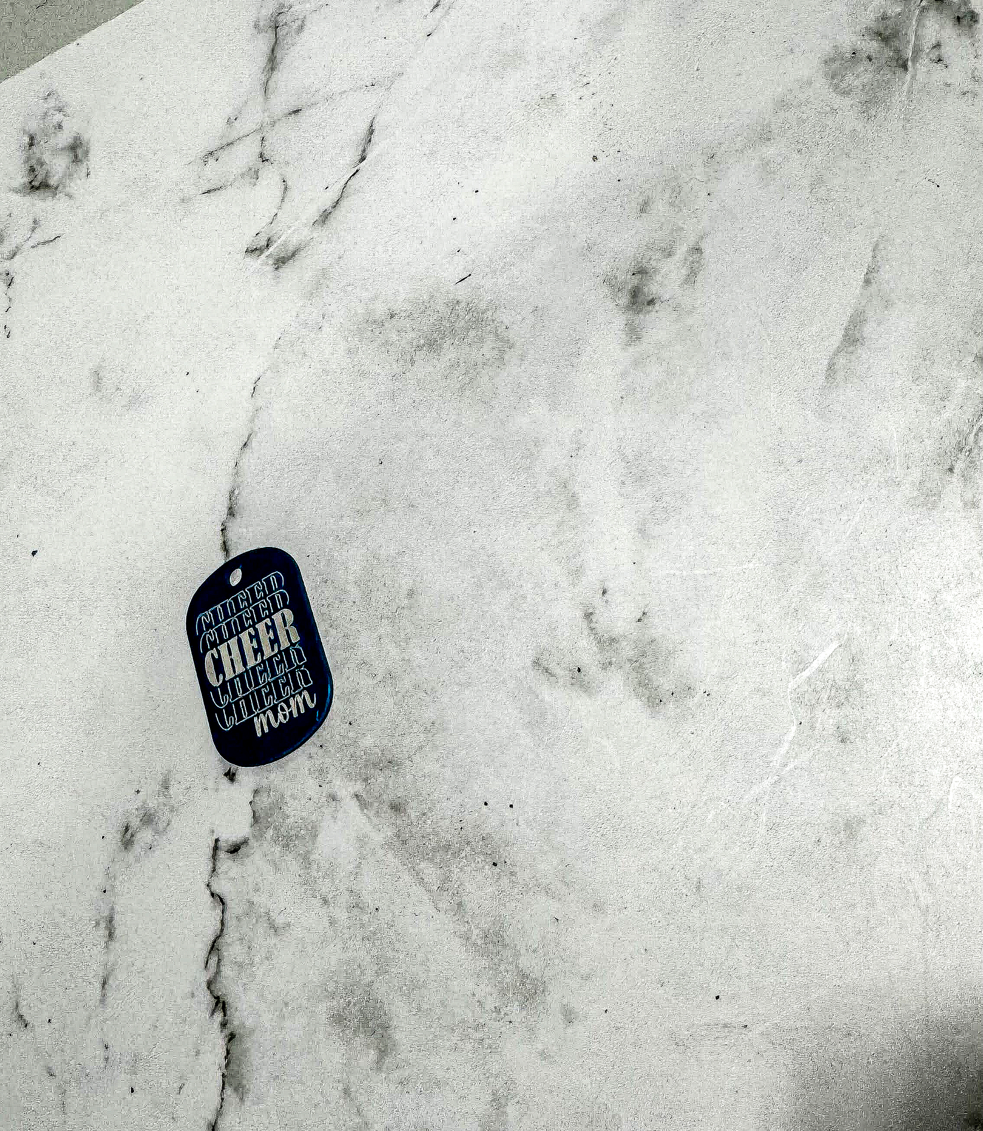 a white marble counter top with a blue tag on it