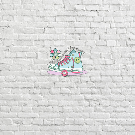 a white brick wall with a pair of sneakers painted on it