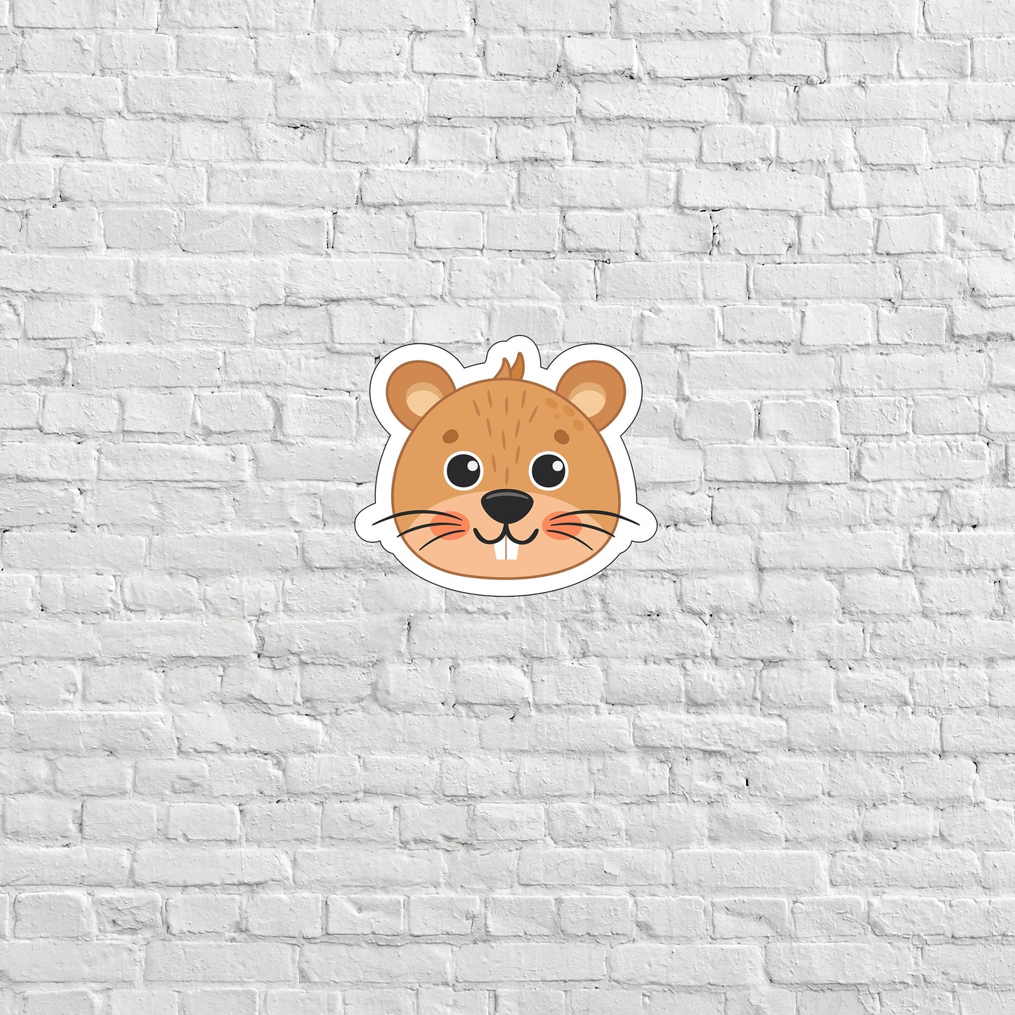 a sticker of a mouse on a white brick wall