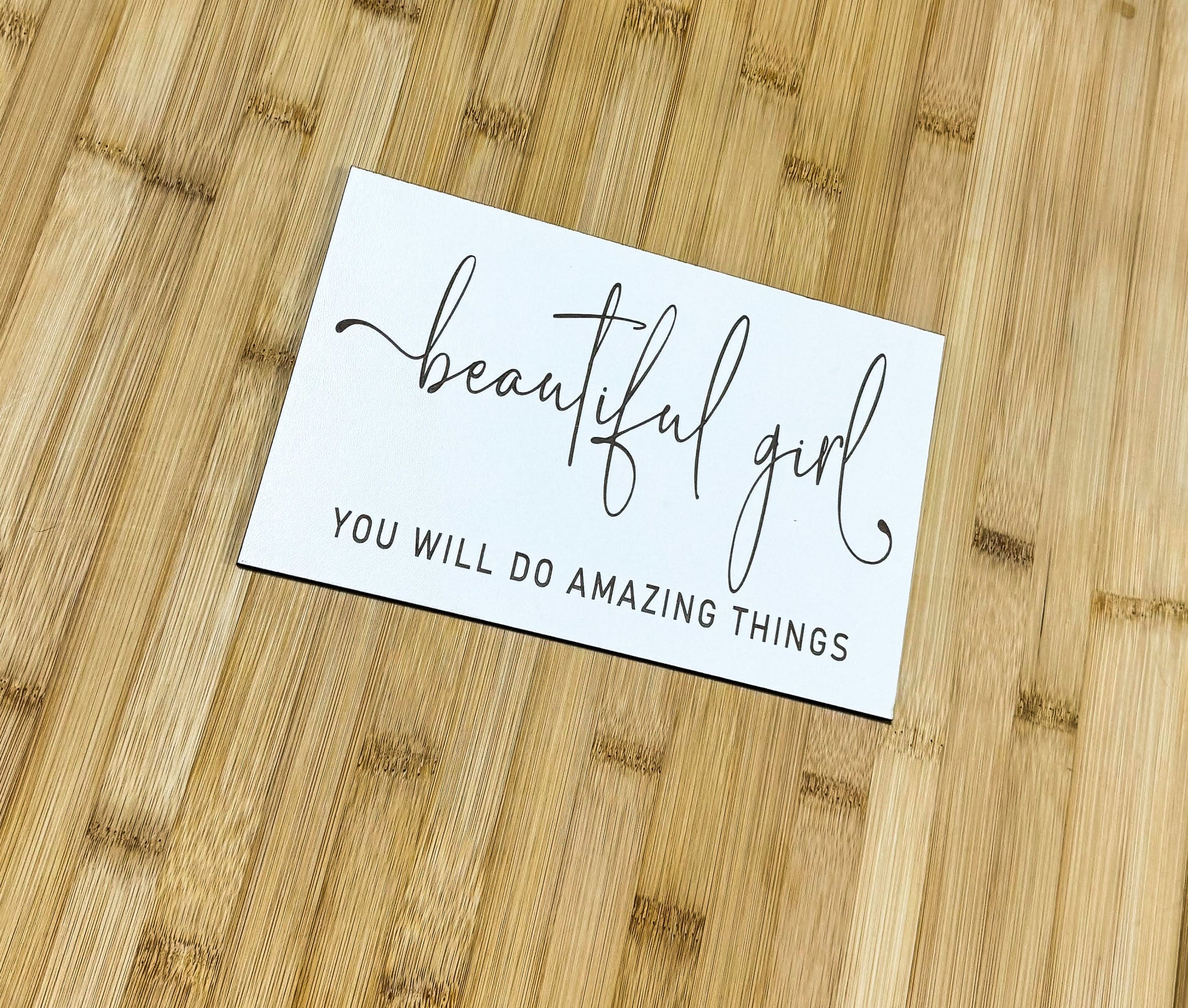 a piece of paper that says, beautiful girl you will do amazing things