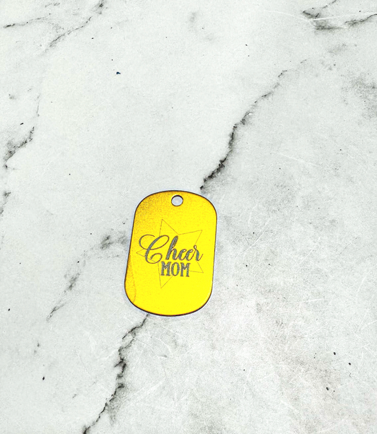 a yellow dog tag that says ohr hot on it