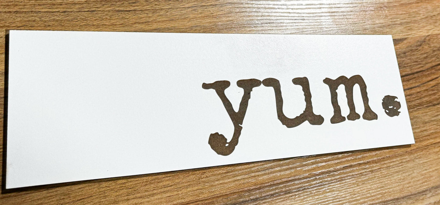 a piece of paper with the word yum written on it