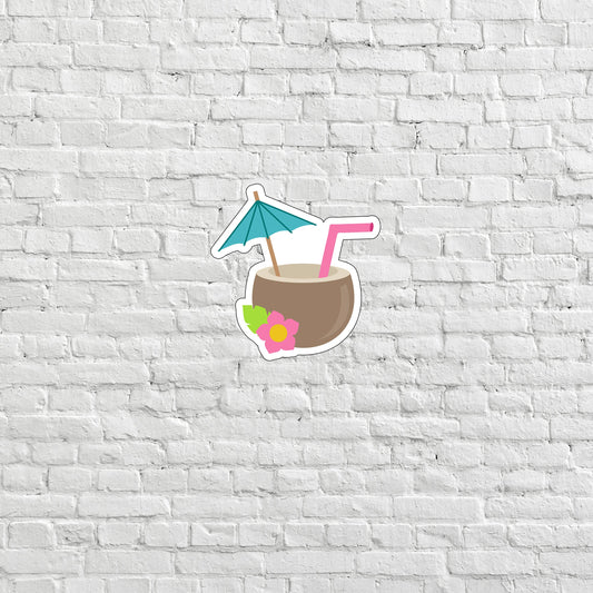 a white brick wall with a sticker of a drink and an umbrella