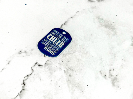 a dog tag laying in the snow on the ground